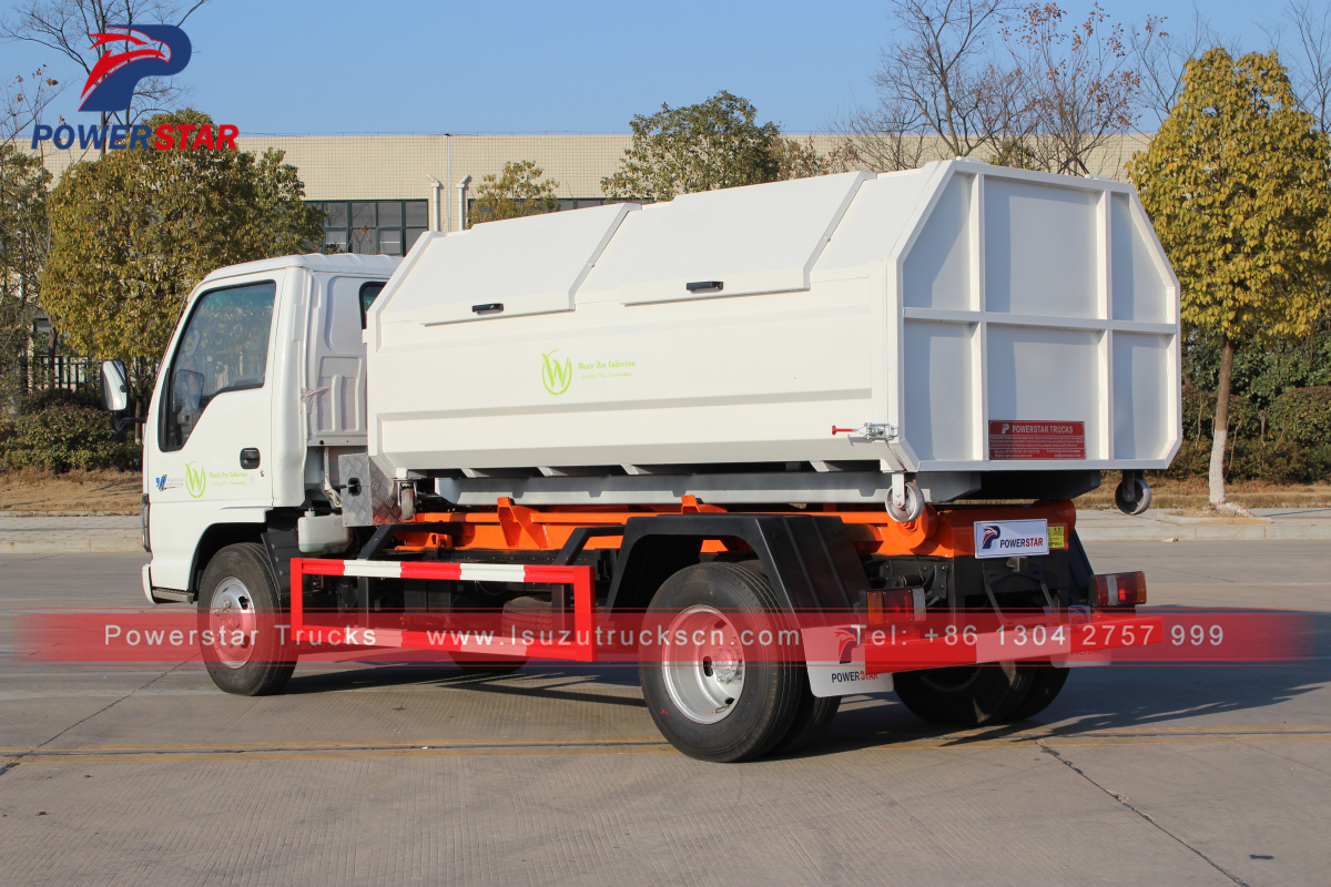 Saint Martin 1 Isuzu Müllwagen mit Hakenlift und 4 Mülltonnen